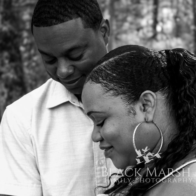 Black and white photograph of husband and wife posing together
